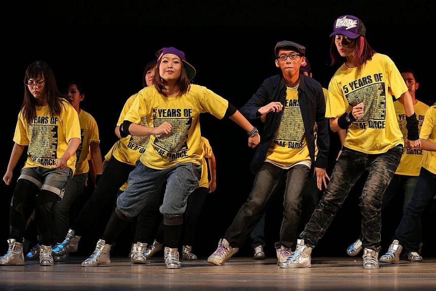 Redeafination (above), a hip-hop dance group for the hearing impaired, performing in Welcome To My World 2013, a concert organised by Very Special Arts. -- PHOTO: ROBIN NG