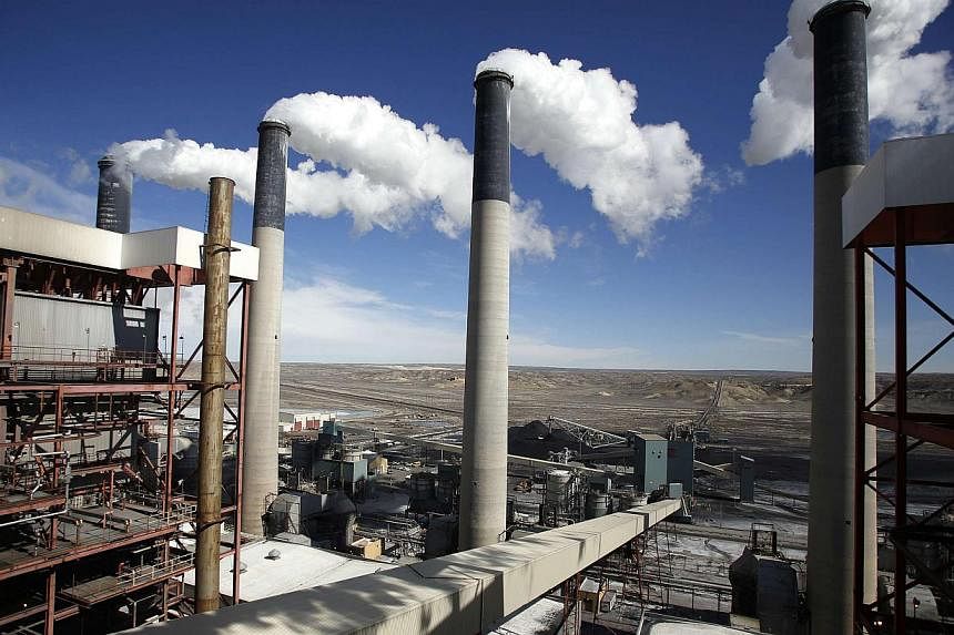 Steam rises from the stacks of the coal-fired Jim Bridger Power Plant outside Point of the Rocks, Wyoming on March 14, 2014. The United States Environmental Protection Agency released a sweeping rule to cut carbon emissions from US power plants by 30