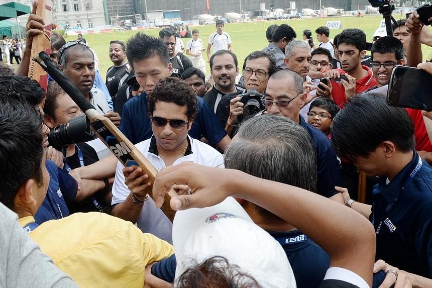 Legendary Indian cricketer Sachin Tendulkar shared his experiences and insights with a group of 30 young cricketers during a special coaching session at the Singapore Cricket Club on Tuesday morning.&nbsp;-- ST PHOTO: AZIZ HUSSIN