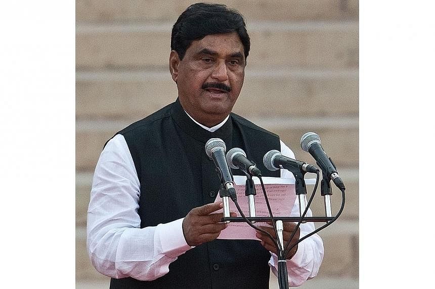 In this photograph taken on May 26, 2014, Bharatiya Janata Party leader Gopinath Munde takes the oath of office during a swearing-in ceremony for new Indian Prime Minister Narendra Modi and his council of ministers in New Delhi. -- PHOTO: AFP
