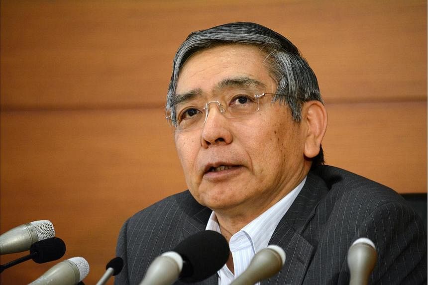 Kuroda reiterated that improvements in the economy have boosted domestic demand and narrowed Japan's output gap to near zero. -- PHOTO: AFP