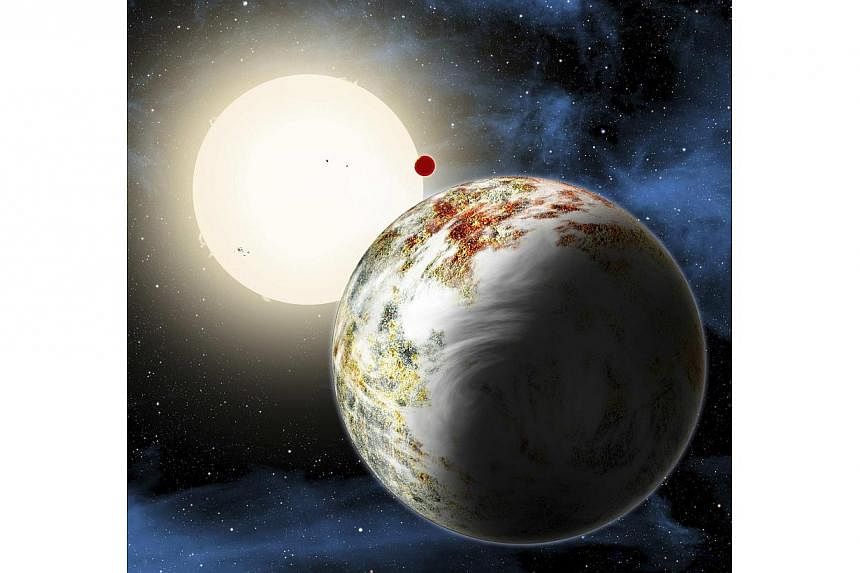 The newly discovered "mega-Earth" Kepler-10c dominates the foreground in this artist's conception released by the Harvard-Smithsonian Center for Astrophysics in Cambridge, Massachusetts on June 2, 2014. -- PHOTO: REUTERS