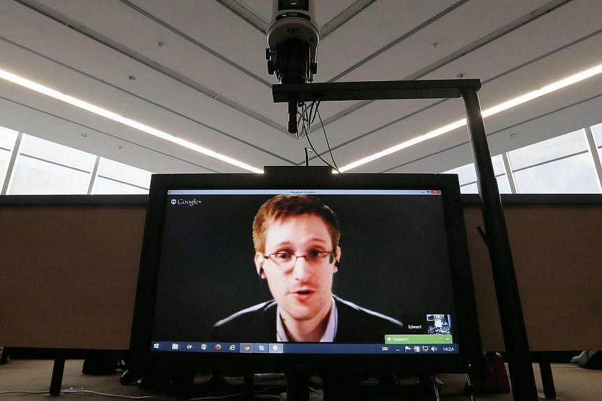 Accused government whistleblower Edward Snowden speaks via video conference with members of the Committee on Legal Affairs and Human Rights of the Parliamentary Assembly of the Council of Europe in Strasbourg in this file photo taken on April 8, 2014