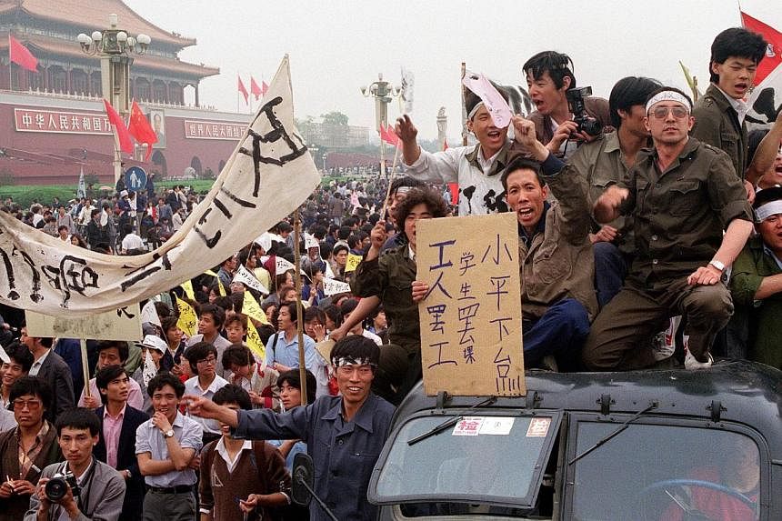 Chinese workers filling the streets of Beijing to support the students' pro-democracy movement and their hunger strike that started six days before during the Beijing Spring movement on May 18, 1989. -- PHOTO: AFP