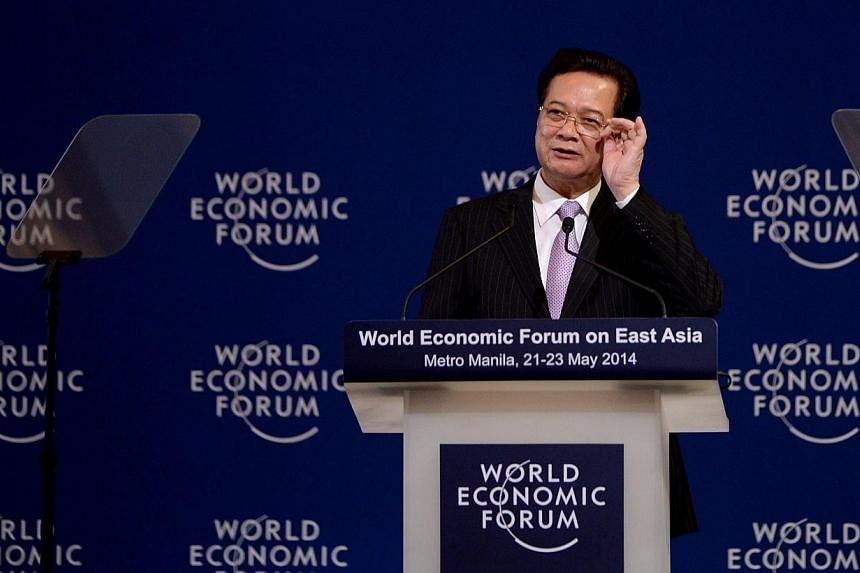Prime Minister of Vietnam, Nguyen Tan Dung, gestures as he gives his remarks during the World Economic Forum on East Asia in Manila on May 22, 2014.&nbsp;Vietnam's prime minister pledged on Thursday, June 4, 2014, to step up economic reforms and prev