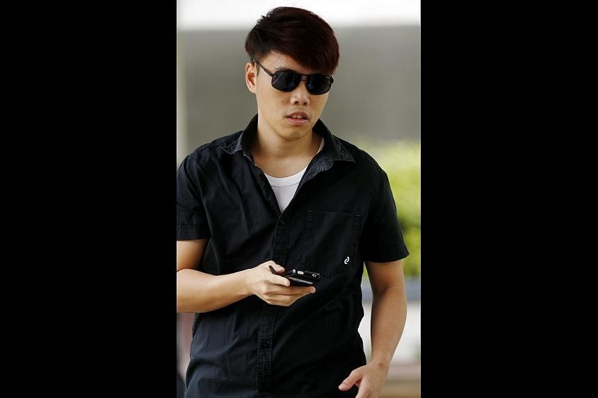 Calvin Kam Mao Xiong, 27, a former SingTel employee who received kickbacks from friends for waiving portions of their phone bills, was fined $6,000 for corruption on Thursday, June 5, 2014. -- ST PHOTO: WONG KWAI CHOW&nbsp;