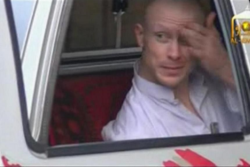 US Army Sergeant Bowe Bergdahl waits in a pick-up truck before he is freed at the Afghan border, in this still image from video released on June 4, 2014. -- PHOTO: REUTERS