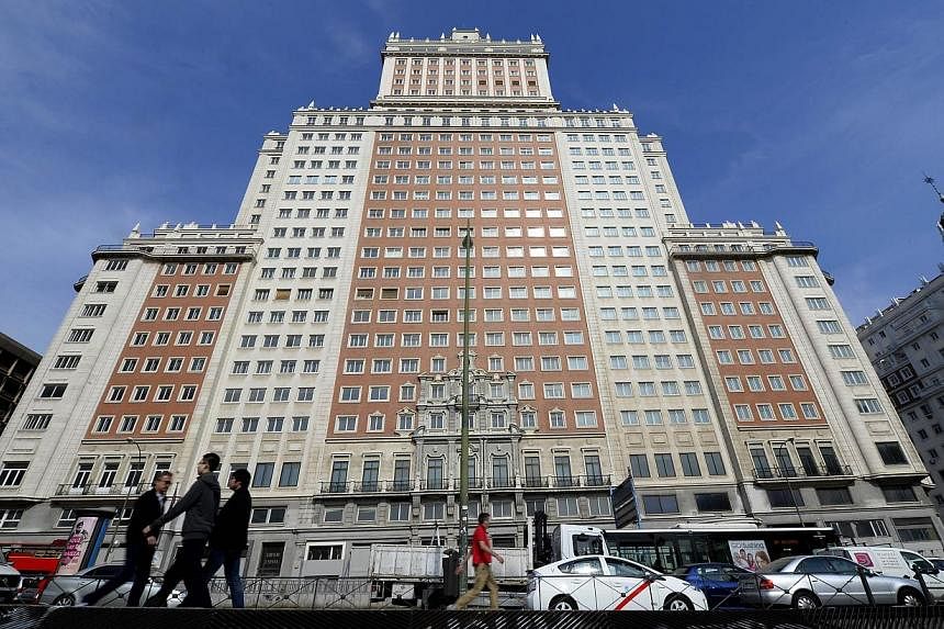 A file picture taken on March 19, 2014 shows the Edificio Espana building on the Plaza de Espana square in Madrid. China's richest man Wang Jianlin bought on June 5, 2014 the historic Madrid skyscraper for 265 million euros, Santander bank announced.
