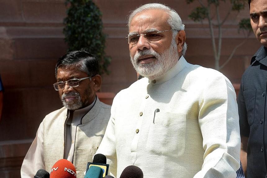 Indian Prime Minister Narendra Modi addressing the media on his arrival for the first session of India's newly elected Parliament in New Delhi on June 4, 2014. -- PHOTO: AFP