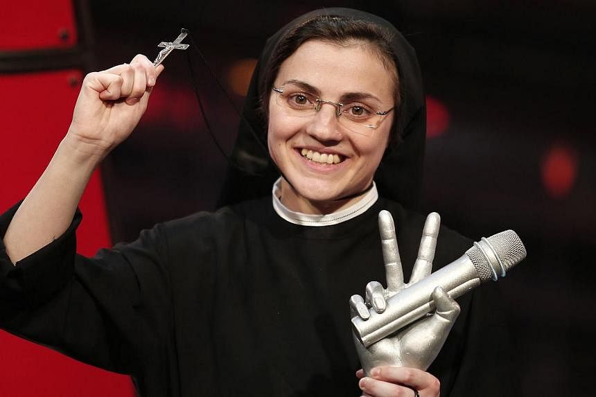 Sister Cristina Scuccia performing during the Italian State RAI TV program, The Voice of Italy, in Milan on June 5, 2014. -- PHOTO: AFP