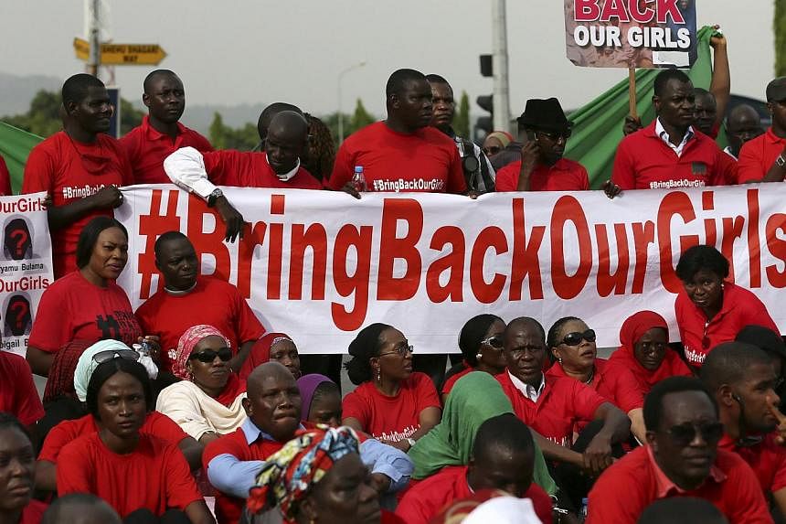 The Abuja wing of the "Bring Back Our Girls" protest group prepare to march to the presidential villa to deliver a protest letter to Nigeria's President Goodluck Jonathan in Abuja, calling for the release of the Nigerian schoolgirls in Chibok who wer