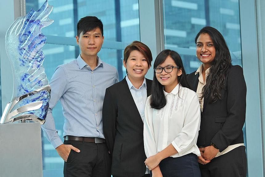 Among 11 polytechnic graduates who have joined Barclays under the British bank's new apprenticeship scheme are (from left): Mr Lyon Chua, 24; Ms Pranee Loo, 27; Ms Nur Asyiqin Abdul Rahim, 19; Ms Fernandez Florence Francine, 26. The 11 will work in a