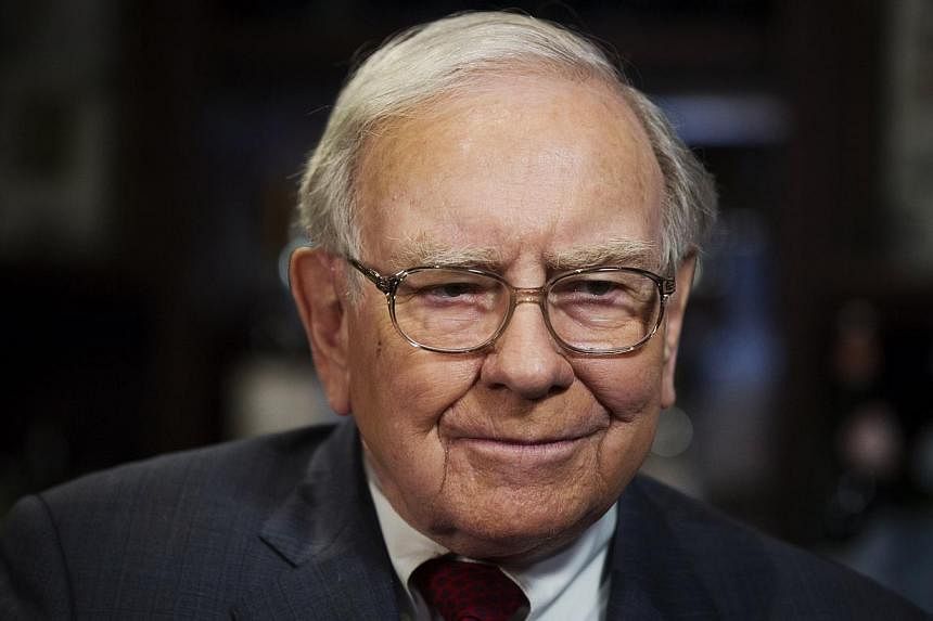 Investor Warren Buffett poses for a portrait during an interview after a luncheon to benefit the Glide Foundation of San Francisco in New York on April 23, 2014. -- PHOTO: REUTERS