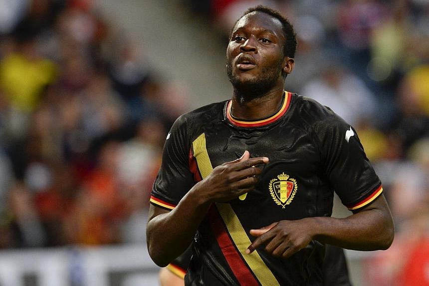 Romelo Lukaku celebrates after scoring a goal during the friendly football match between Sweden and Belgium at Friends Arena in Solna, near Stockholm on June 1, 2014. -- PHOTO: AFP