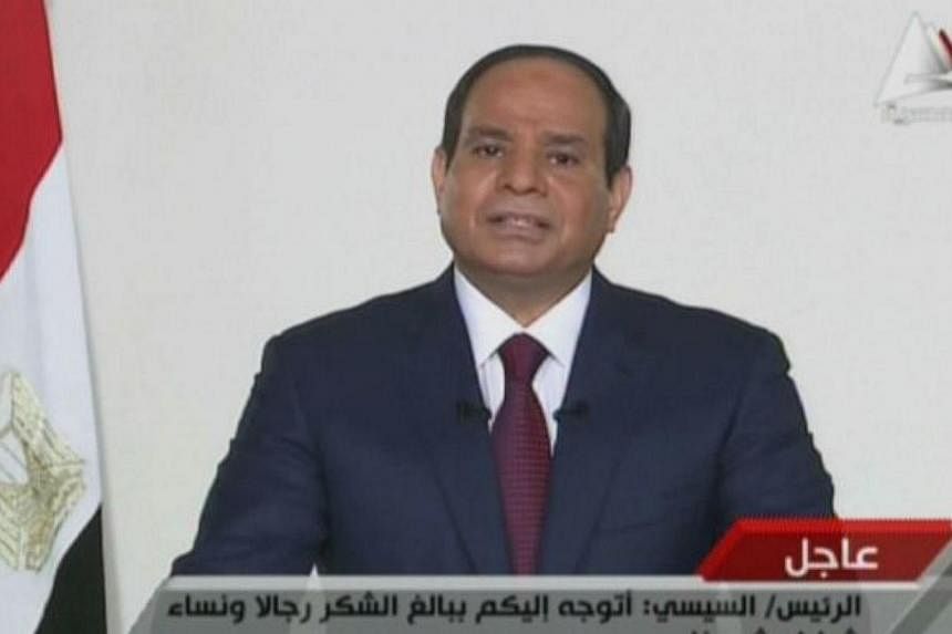 An image grab taken from Egyptian state TV shows ex-army chief and newly elected Egyptian President Abdel Fattah al-Sisi speaking in a televised address to his nation on June 3, 2014, after the electoral commission announced he won 96.9 percent of vo