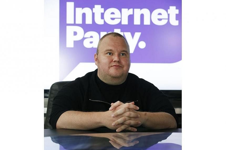 Kim Dotcom talks exclusively to Reuters during his Internet Party pool party at the Dotcom mansion in Coatesville, Auckland April 13, 2014.&nbsp;A New Zealand government-allied MP with links to Internet tycoon Kim Dotcom announced his resignation on 