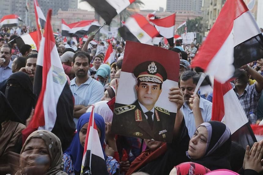 Egyptians chant slogans in Tahrir square as they arrive to celebrate former Egyptian army chief Abdel Fattah al-Sisi's victory in the presidential vote in Cairo, June 3, 2014. -- PHOTO: REUTERS