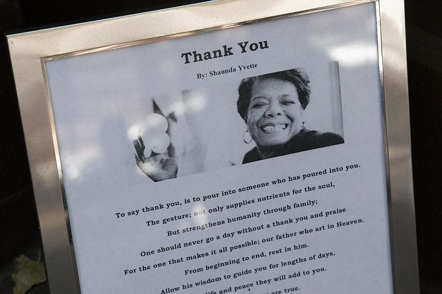 A picture of Dr. Maya Angelou is placed in front of Angelou's home in Harlem in New York City&nbsp;on May 31, 2014. -- PHOTO: AFP