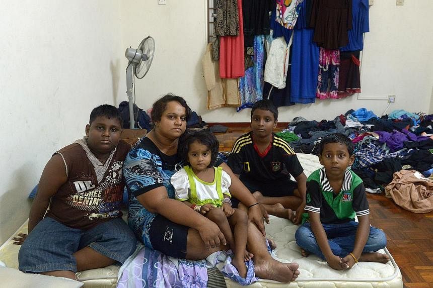 Madam Pusparani Mohan with her children, (top, from left) eldest son Sarveswaran, 11, daughter Thurgashini, two, and sons Dharmaa, 10, and Mageswaran, seven. When news broke of her husband being killed in a freak accident at the Budget Terminal in Ma