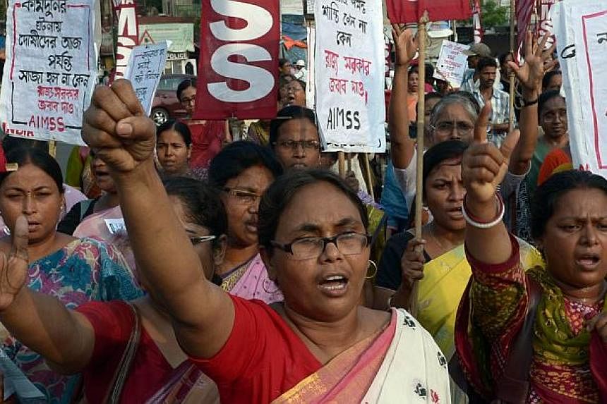 Indian activists from the Social Unity Center of India (SUCI) shout slogans against the state government in protest against the gang-rape and murder of two girls in the district of Badaun in the northern state of Uttar Pradesh and recent rapes in the