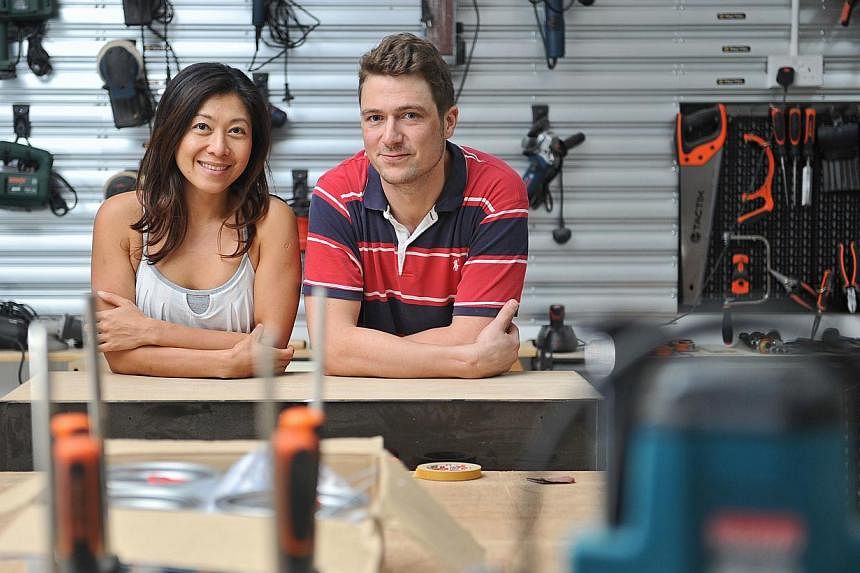 German carpenter Till Oliver Kautz, 30, and his girlfriend, Ms Fiona Wong, 37, at Home-Fix DIY's "maker space", located at its Tai Seng headquarters. -- ST PHOTO: MATTHIAS HO