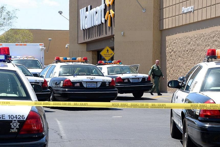 The attackers then headed to a nearby Walmart store, exchanging gunfire with and ultimately killing a civilian who was carrying a concealed weapon. -- PHOTO: AFP