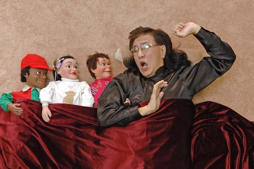 &nbsp;Victor Khoo talks to his puppets (from left) Char Cole, Cha Cha and Charlee before every big show. -- PHOTO: ST FILE