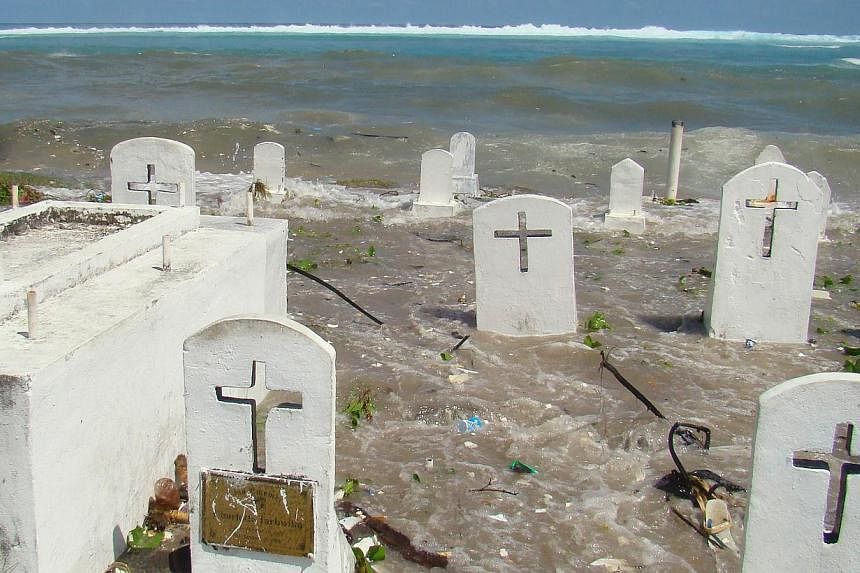 This file photo taken in Dec, 2008, shows a cemetery on the shoreline in Majuro Atoll being flooded from high tides and ocean surges.&nbsp;The skeletal remains of what are believed to be Japanese soldiers have been exposed on a remote Pacific island 