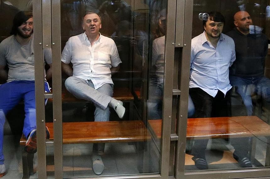 Defendants in the murder trial of Russian journalist and human rights activist Anna Politkovskaya, (from left) Ibragim Makhmoudov, Lom-Ali Gaitukayev, Dzhabrail Makhmoudov, Rustam Makhmoudov and Sergei Khadzhikurbanov attend a court hearing in Moscow
