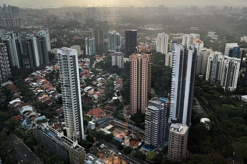 High-rise condominium buildings in the Singapore city centre and outskirts on Feb 1, 2011. Resale prices of completed non-landed private homes in Singapore continued to drop last month, as the number of transactions fell. -- ST PHOTO: FILE