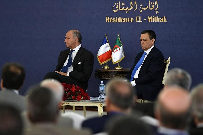French Foreign Minister Laurent Fabius (left) appears to be sleeping during a conference with Algerian Minister of Industry and Mining, Abdeslam Bouchouareb (right), in the capital Algiers on June 9, 2014.&nbsp;French Foreign Minister Laurent Fabius 