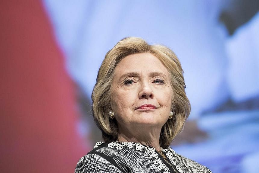 Hillary Clinton (above) in her new book passionately defended her role in the release of Chinese dissident Chen Guangcheng, criticising Republican assertions that the United States pressured him. -- PHOTO: AFP