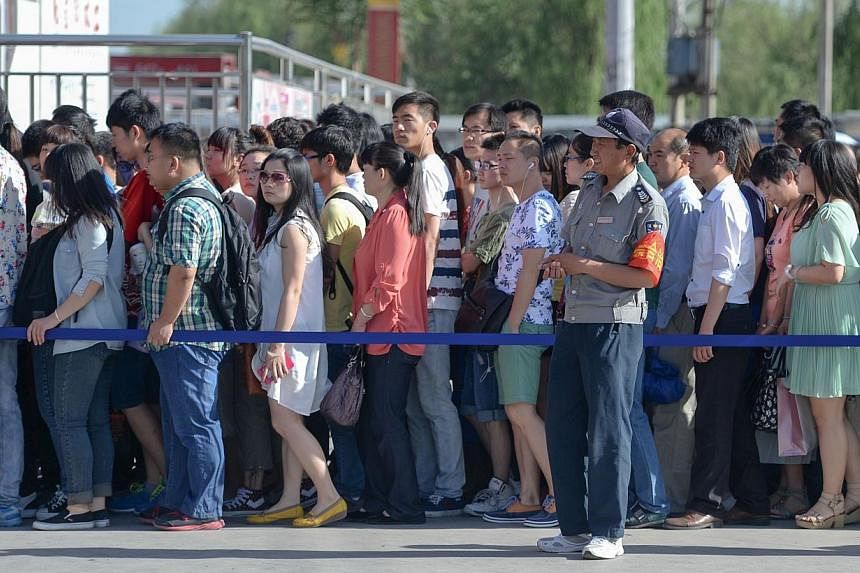 China's capital Beijing on Tuesday launched a new effort to "civilise" its residents by clamping down on queue-jumping and smoking ahead of a summit for Asian leaders later this year. -- PHOTO: AFP