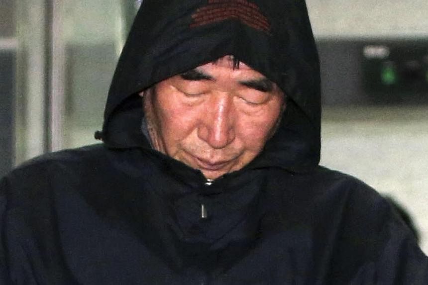 Lee Joon Seok, captain of South Korean ferry Sewol which sank at sea off Jindo, walks out of court after an investigation in Mokpo on April 19, 2014. -- PHOTO: REUTERS