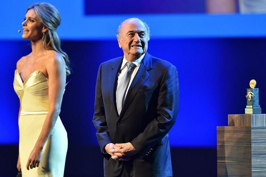 President of FIFA Sepp Blatter (right) stands on stage during the opening ceremony of the FIFA Congress in Sao Paulo on June 10, 2014. -- PHOTO: AFP
