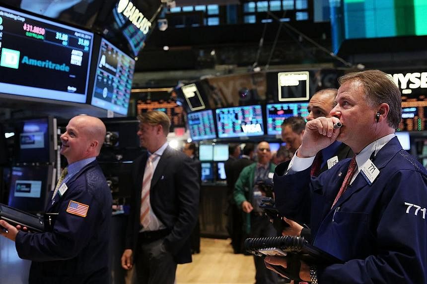 Traders work on the floor of the New York Stock Exchange&nbsp;in New York City&nbsp;on April 30, 2014. -- PHOTO: AFP