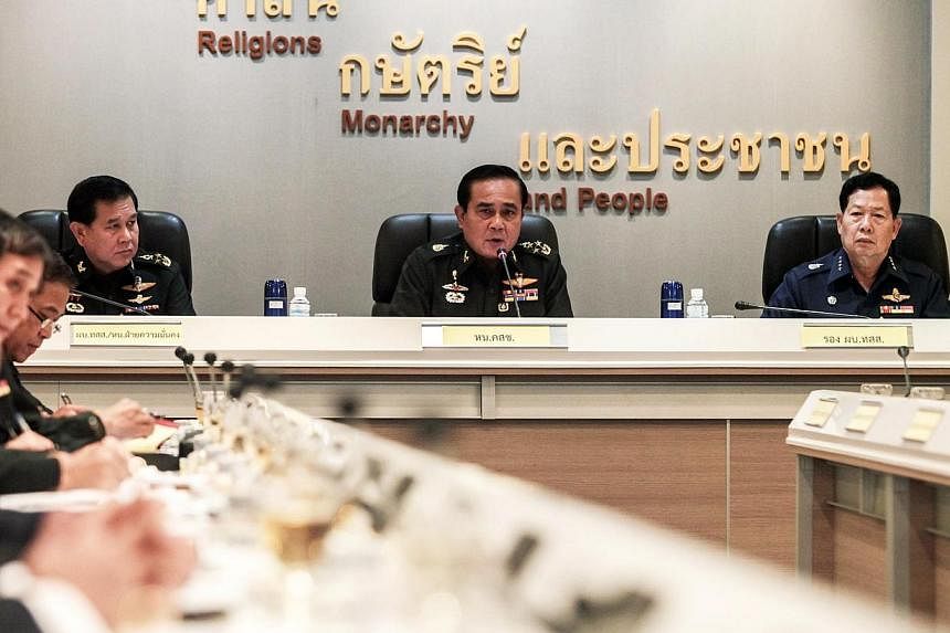 Thai Army chief, General Prayuth Chan-ocha, speaking during a meeting with Thai ambassadors at the Royal Thai Army Headquarters in Bangkok on June 11, 2014. A delegation of Thai military commanders travelled to China on Wednesday for talks on regiona