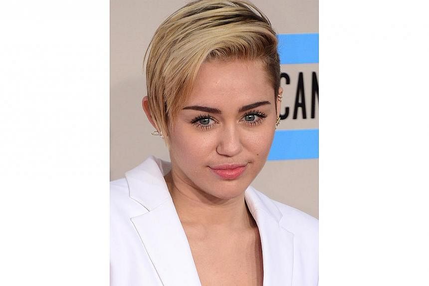 US pop star Miley Cyrus at the 2013 American Music Awards in Los Angeles on Nov 24, 2013. -- PHOTO: AFP&nbsp;