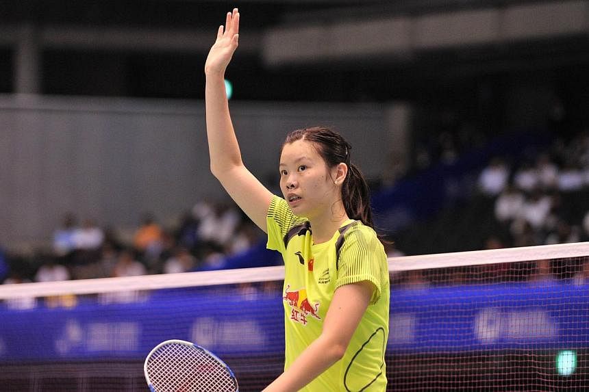 China's Li Xuerui celebrates after beating Japan's Akane Yamaguchi during their women's singles first round match at the Japan Open badminton tournament in Tokyo on June 11, 2014.&nbsp;China's Olympic badminton champion Li Xuerui survived a scare in 