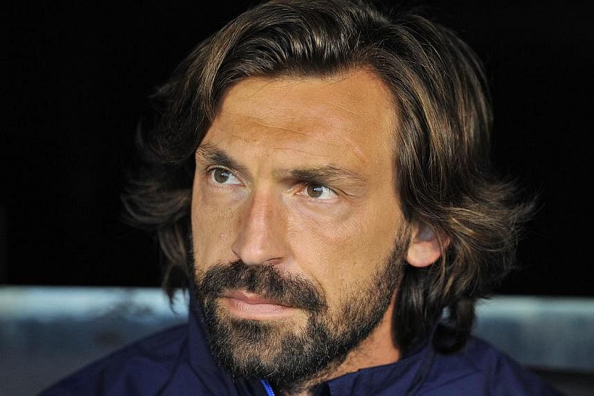 Italy playmaker Andrea Pirlo has signed a new two-year deal with Juventus which will keep him at the Serie A football champions until 2016, the club said on Wednesday. -- PHOTO: AFP