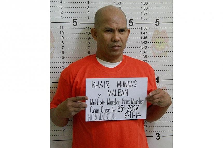 This handout photo taken on June 11, 2014, and released by the Philippine National Police shows senior Philippine Islamic militant Khair Mundos posing for his mugshot after he was arrested in Manila following a manhunt lasting seven years.&nbsp;-- PH