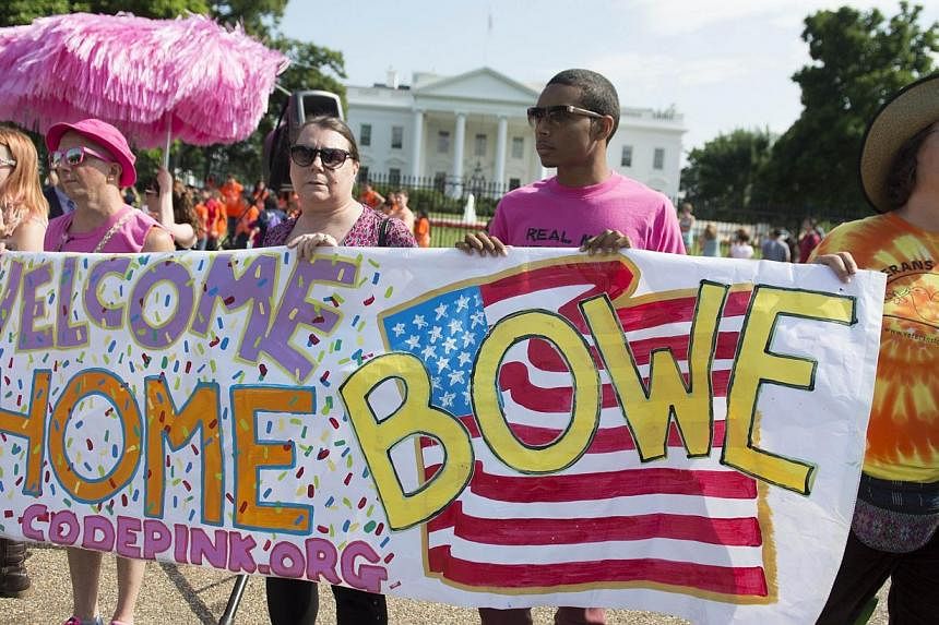 Supporters of freed prisoner of war US Army soldier Bowe Bergdahl including representatives of the ANSWER Coalition, CODEPINK and March Forward, rally in front of the White House in Washington, DC, June 10, 2014, to welcome Bergdahl home after 5-year