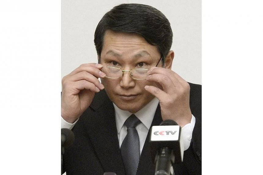 South Korean missionary, identified by the North as Kim Jong Wook, adjusts his glasses during a news conference in Pyongyang on Feb 27, 2014.&nbsp;North Korea on Thursday, June 12, 2014, rejected Seoul's call for talks on the fate of a South Korean m