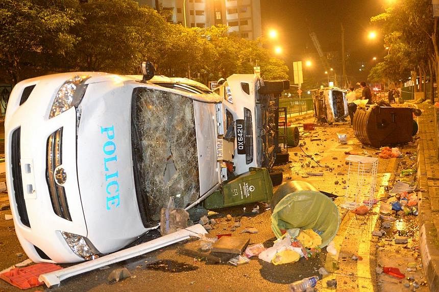 The debris of the police patrol cars after a riot that broke out at Little India on 8 December 2013. -- PHOTO: ST FILE