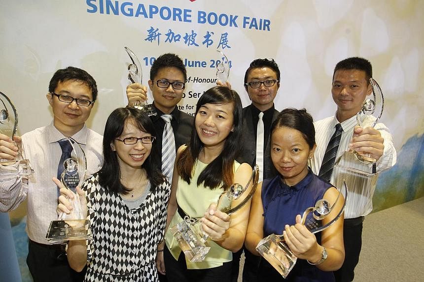 The award winners at the ceremony held during the launch of the Singapore Book Fair yesterday were (front row, from left) Ms See Hui Chen, Ms Hoe Mei Hwee and Madam Dong Yan; (back row, from left) Mr Liu Zhao, Mr Liong Peen Lee, Mr Chong Yew Fook and