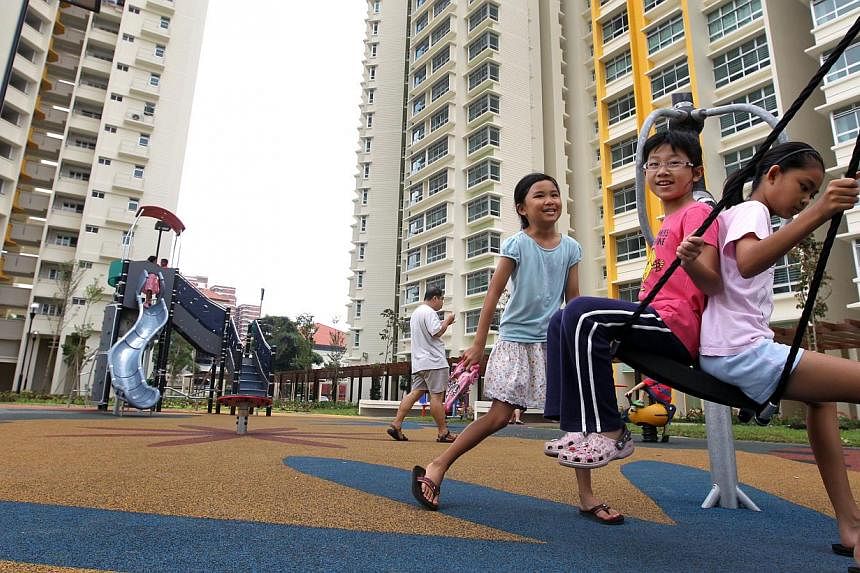 Children enjoying the playground facilities at Dawson Estate in Queenstown. -- PHOTO: ZAOBAO