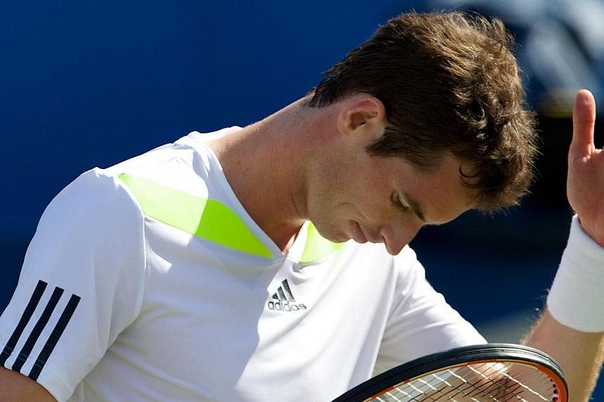 Britain's Andy Murray reacts after losing a point against Czech Republic's Radek Stepanek of the during their third round match on the fourth day of the ATP Aegon Championships at the Queen's Club in west London on June 12, 2014. -- PHOTO: AFP