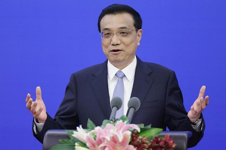 China's Premier Li Keqiang delivers a speech during a celebration to mark 40th Anniversary of the Establishment of Diplomatic Relationship between Malaysia and China at the Great Hall of the People, in Beijing on May 31, 2014.&nbsp;Mr Li visits Brita