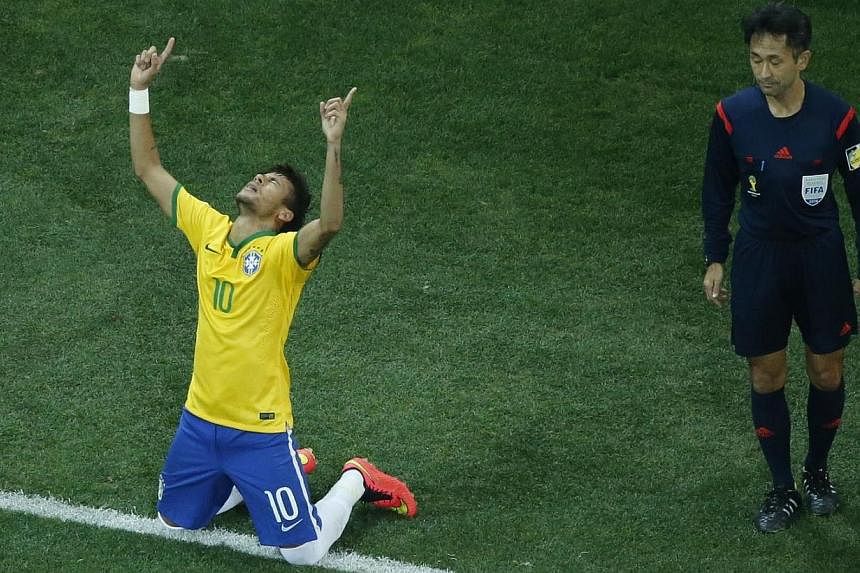 Brazil's Neymar (left) celebrates after scoring a penalty during the 2014 World Cup opening match against Croatia at the Corinthians arena in Sao Paulo on June 13, 2014. -- PHOTO: REUTERS