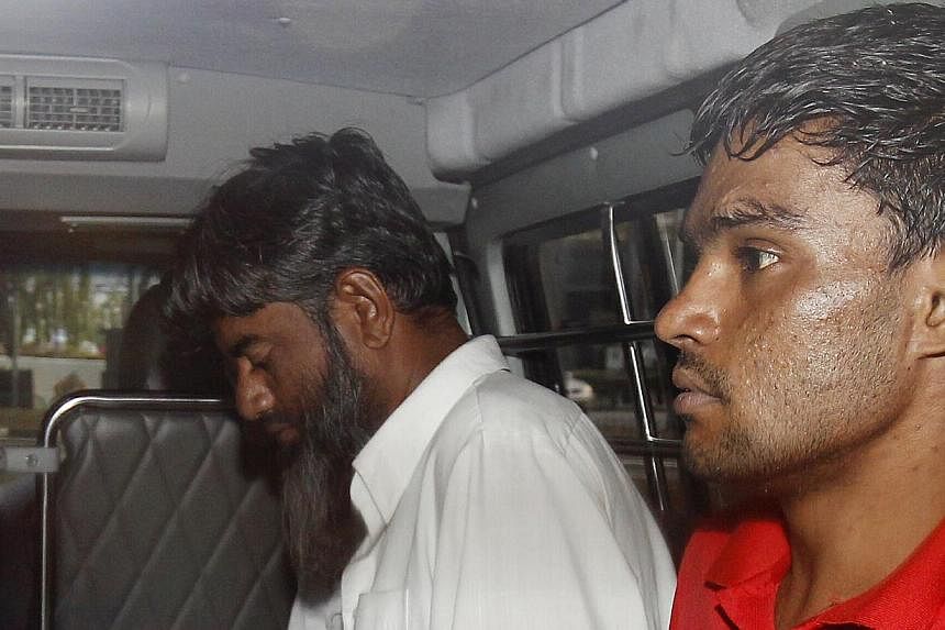 (From left) The two Pakistanis Rasheed Muhammad, 43, and Ramzan Rizwan, 25, who are accused of murder. -- ST PHOTO: WONG KWAI CHOW